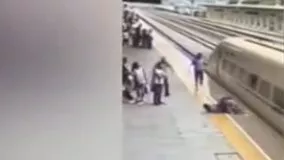 نجات زنی که قصد داشت خودش را زیر قطار بیاندازد